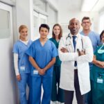 Home health professional or caregiver supporting a client with daily activities at home